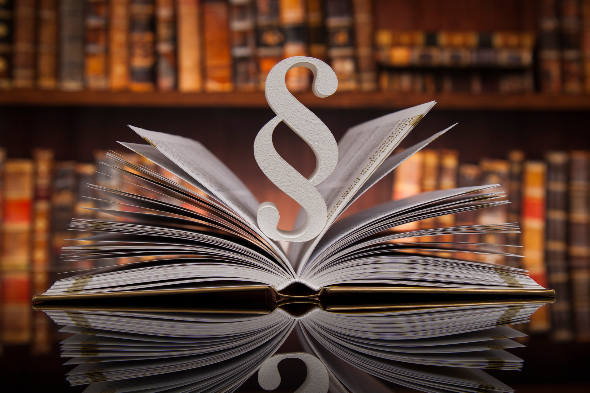 Legislation - Paragraph Paragraph in an open book in a library.