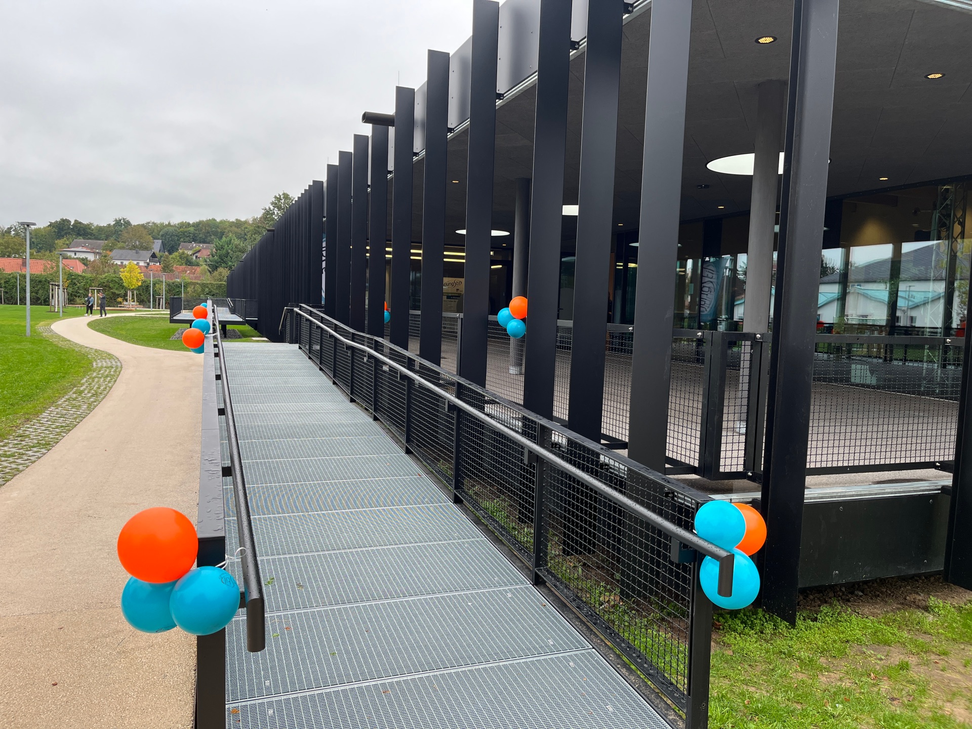 Inauguration of the House for Youth and Family The entrance to the House for Youth and Family is decorated with colourful balloons for the inauguration.