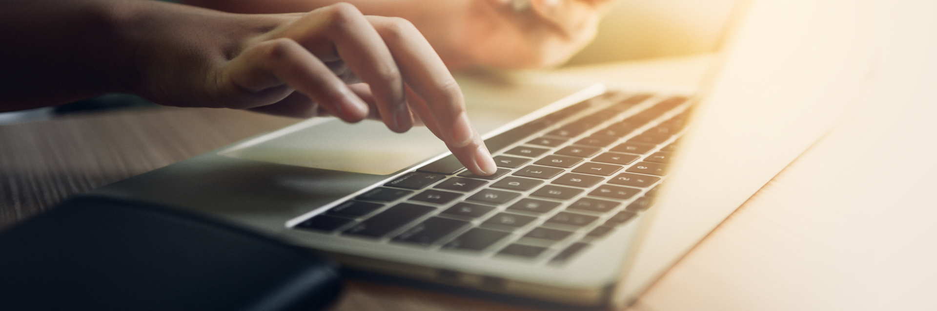 Online appointment booking A person confirms an entry on the computer by pressing Enter.