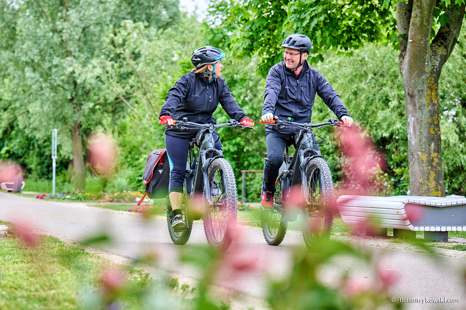 Two people cycling along the Main cycle path