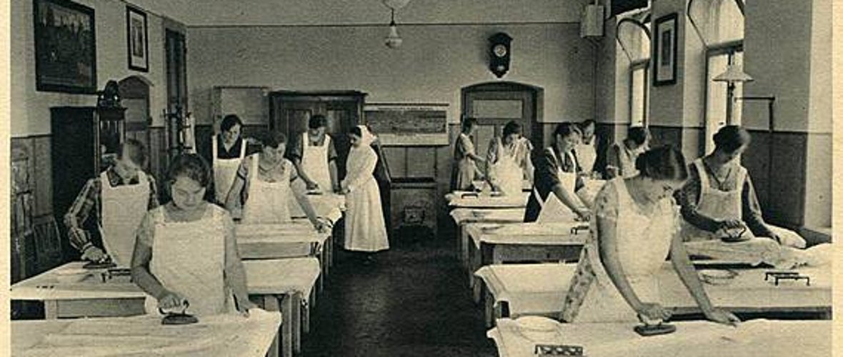 Women ironing in an old ironing room