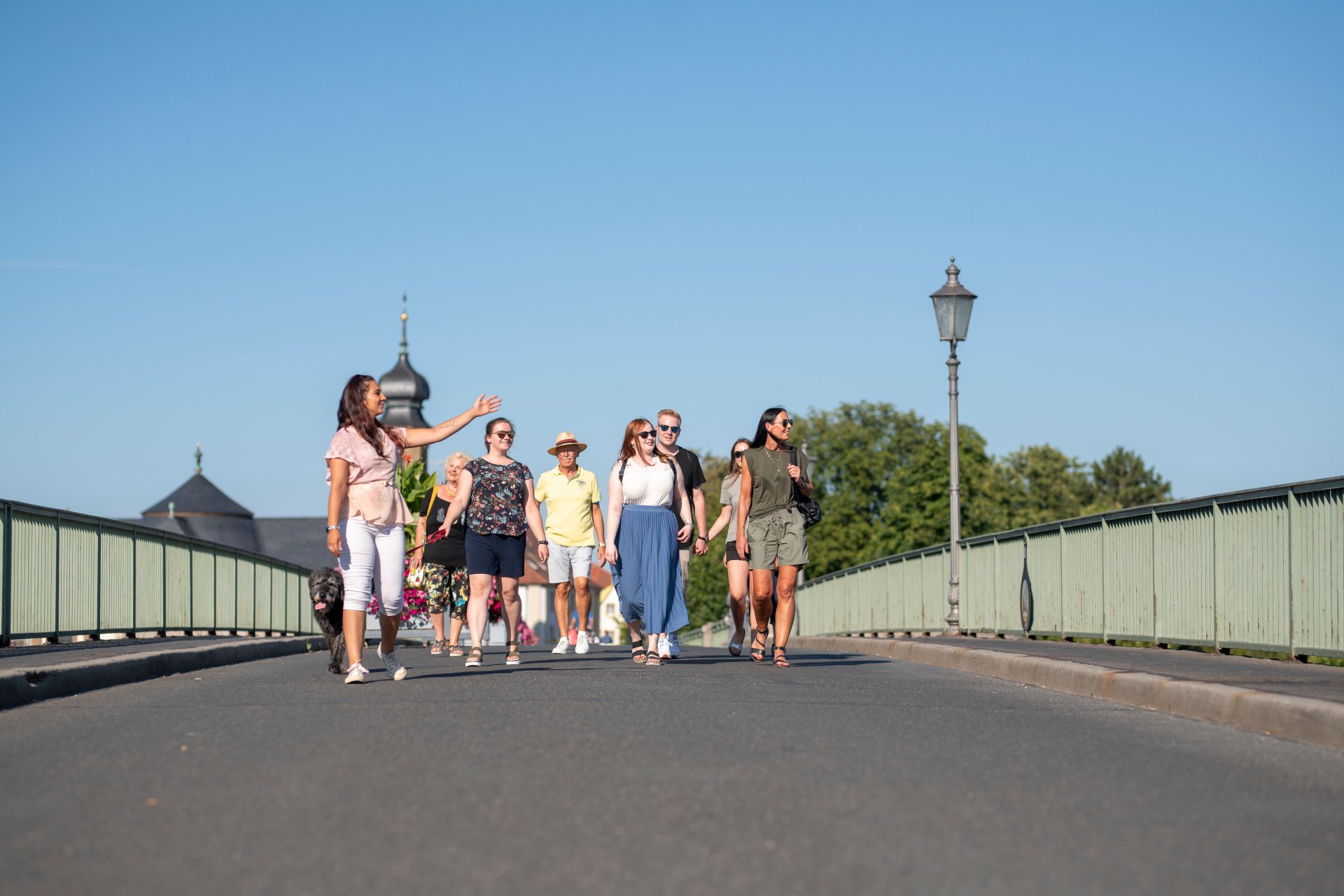 Participants of a guided tour standing on the Old Main Bridge