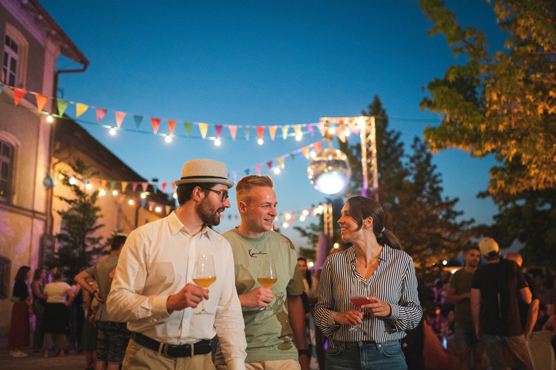 Kitzingen Promenade Wine Festival Guests at the Kitzingen Promenade Wine Festival with wine glasses in hand