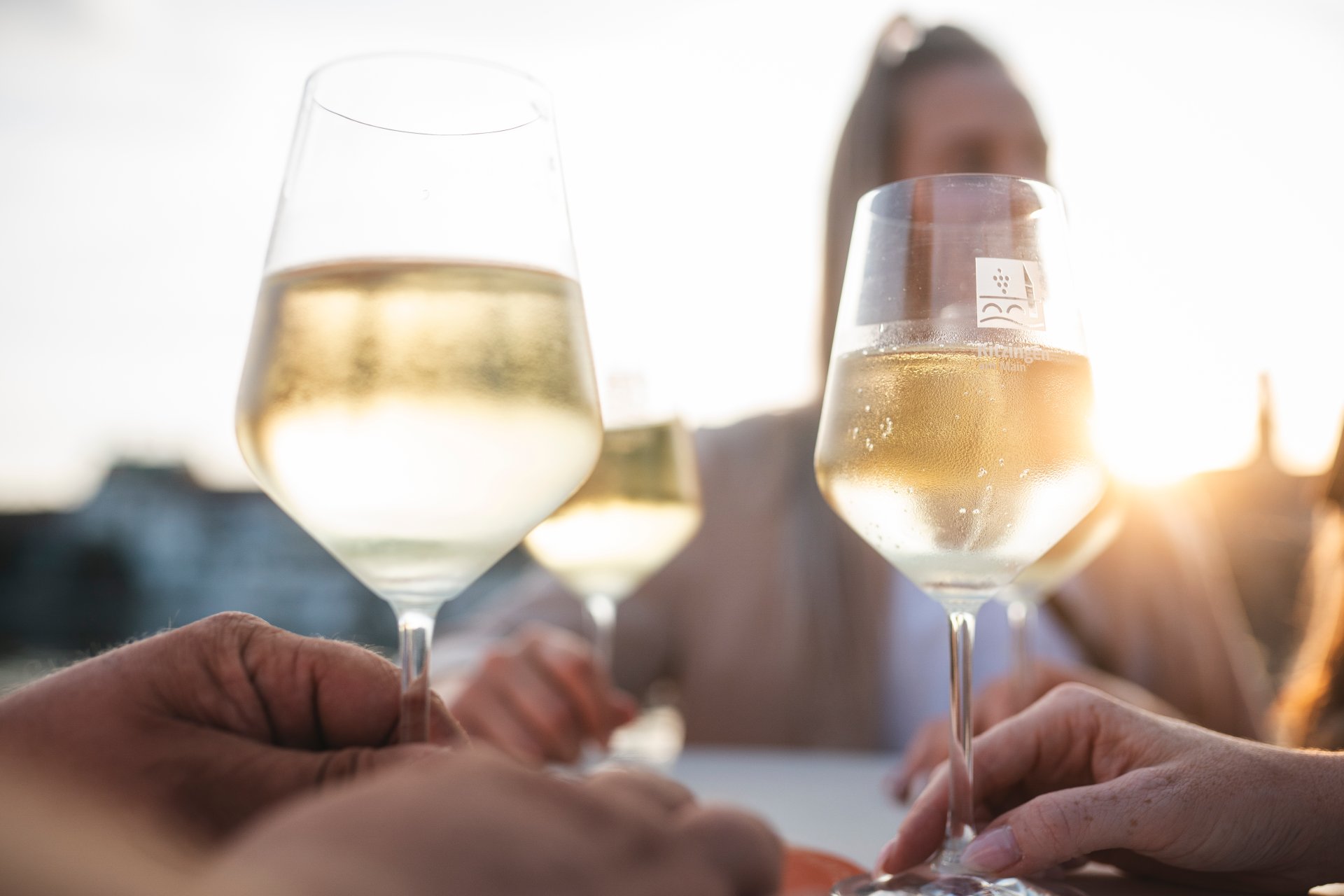 StadtSchoppen in Kitzingen Three wine glasses filled with white wine